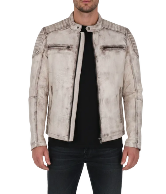 A man wearing a distressed off-white leather jacket with black zippers and trim,
