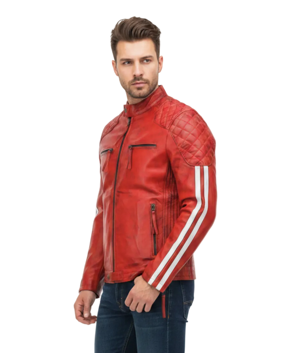 A man wearing a red quilted leather jacket with white stripes on the sleeves, paired with dark blue jeans and brown leather shoes, standing against a plain white studio background.